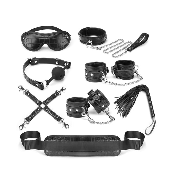 Temptation 8 Pieces Bondage Kit including blindfold, ball gag, collar and leash, wrist and ankle cuffs, flogger, hog tie, and enhancer strap in black faux crocodile leather