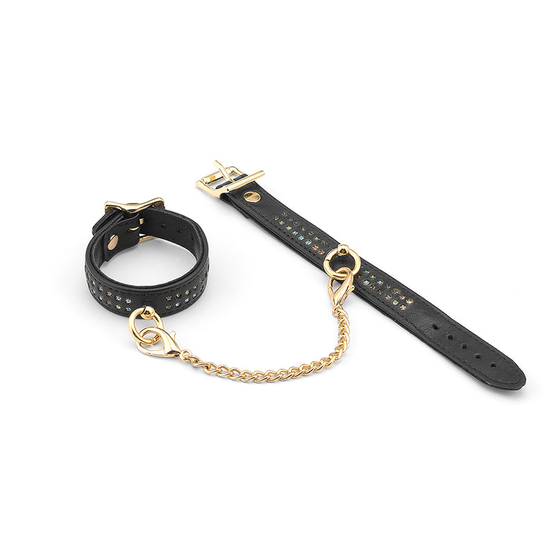 LIEBE SEELE Shining Girl black leather wrist cuffs with gems and golden chain, premium bondage accessory