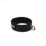 Black vegan leather bondage collar with gold hardware from the Dark Candy collection.