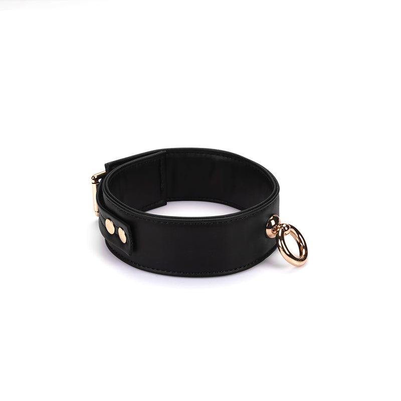 Black vegan leather bondage collar with gold hardware from the Dark Candy collection.