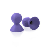 Pair of purple silicone vacuum nipple suckers for nipple play, eco-friendly and reusable, showcased on a white background