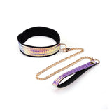 Holographic purple collar and wrist cuff with golden chain leash from the Vivid Murasaki Soft Bondage Kit