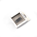 Black magnetic nipple clamps in marble-designed packaging, clearly displayed through window on box, labeled for BDSM bedroom use