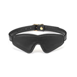Black Vegan Leather Blindfold from Dark Candy collection, adjustable with golden buckle for bondage play