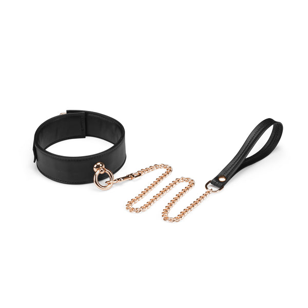 Black vegan leather bondage collar with gold chain leash from Dark Candy collection.