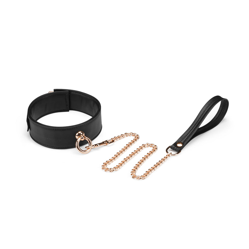 Black vegan leather bondage collar with gold chain leash from Dark Candy collection.