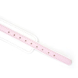 Close-up of Fairy white and pink leather BDSM collar with rose gold metal details and adjustment holes