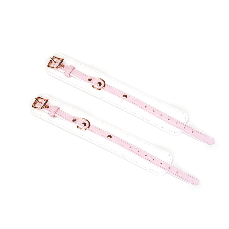 Pink and white leather ankle cuffs from Fairy collection with rose gold adjustable buckles and D-rings for BDSM play