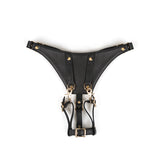 Premium black leather forced orgasm strap-on harness with gold hardware, designed for BDSM play, from the Dark Secret collection
