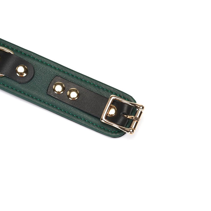 Close-up of Mossy Chic Leather Collar with gold buckle and green-black leather strap, adjustable fetish wear