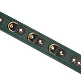 Close-up view of mossy chic green leather bondage collar with gold metal buckles and grommets, adjustable luxurious S&M accessory