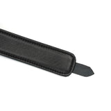Black leather bondage strap close-up, part of the Mossy Chic Leather Collar with Leash set for BDSM play