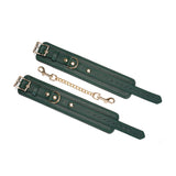 Mossy chic leather wrist cuffs with gold hardware for bondage play