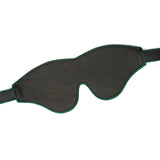 Mossy Chic high-quality leather blindfold with adjustable strap for sensory deprivation play, featuring luxurious leather and meticulous green stitching