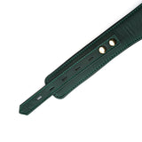 Close-up of Mossy Chic green leather bondage collar with gold metal hardware and detailed stitching, adjustable for erotic BDSM play
