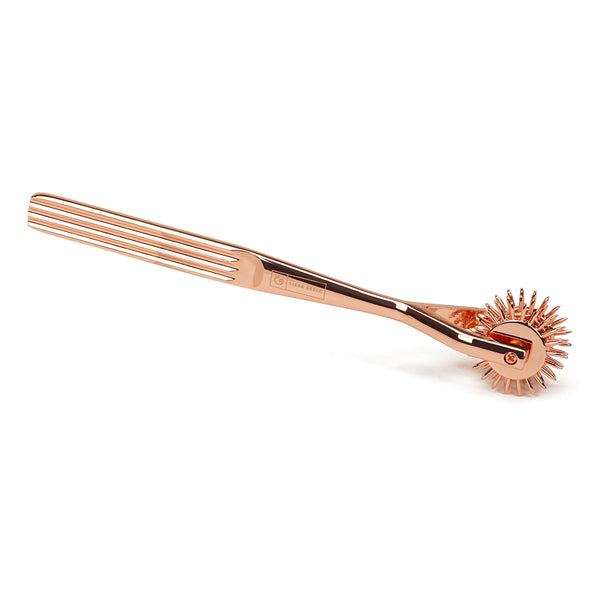 Rose gold three-row Wartenberg Pinwheel for sensory play, part of the X-ROSE collection