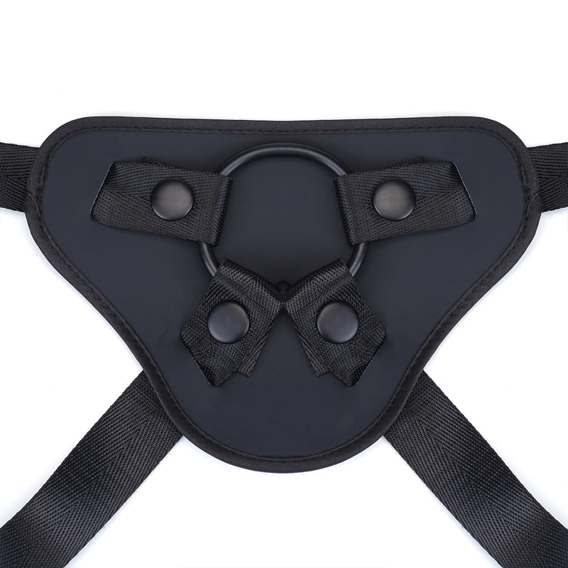 Vegan leather strap-on harness with adjustable O-rings and straps for pegging play, compatible with various erotic toys