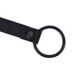 Black faux leather strap-on harness with metal O-ring and adjustable strap. Vegan Fetish collection for pegging and strap-on play.