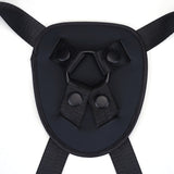 Black vegan leather strap-on harness with enhancer straps for pegging and strap-on play, adjustable for a perfect fit
