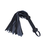 Vegan leather flogger with braided handle and loop for hanging, designed for ethical BDSM play