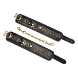 Crocodile Noir: Black Leather Wrist Cuffs with Bronze Hardware