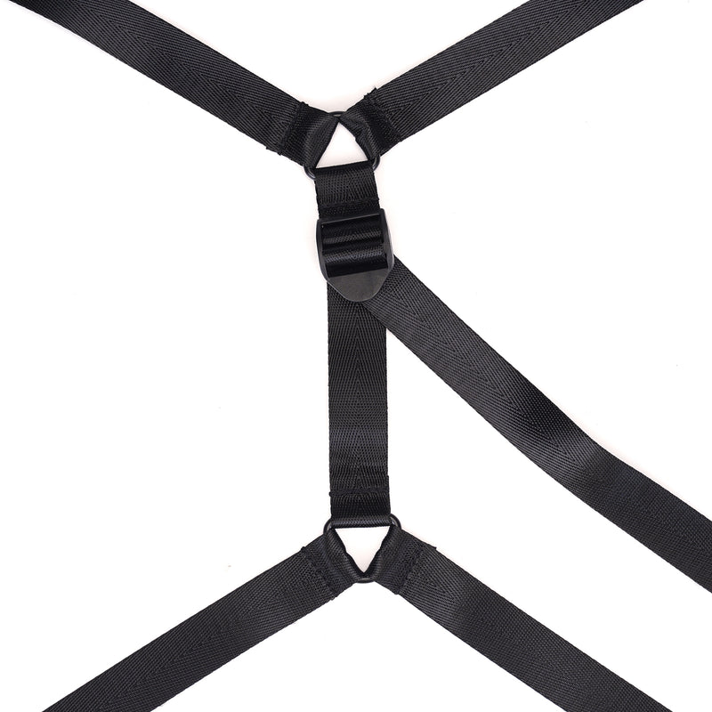 Close-up view of black vegan leather under-bed restraint with adjustable straps and central quick-release buckle for bondage beginners