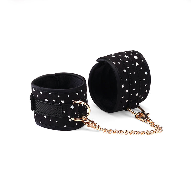 Starry Nights Beginner's Bondage Kit wrist restraints with white star pattern and gold chain detail