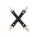 Starry Nights themed hogtie from the Bound You Beginner's Bondage Kit with gold hardware and black faux leather.