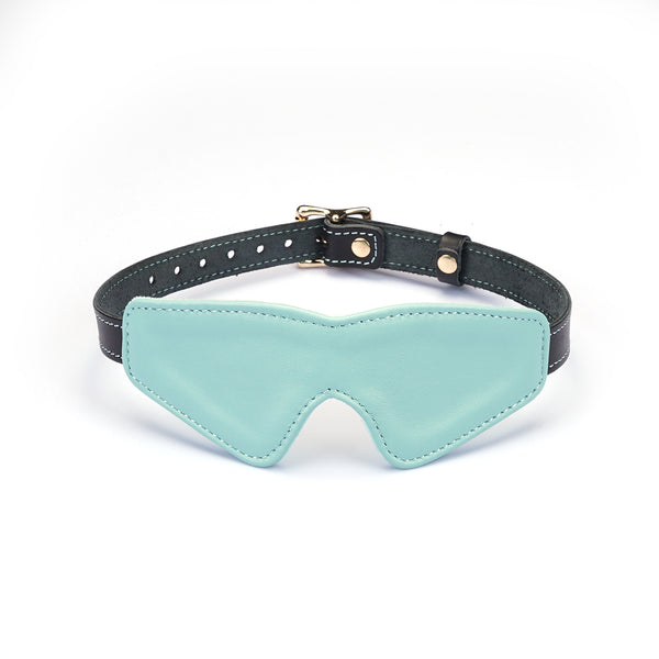 Italian leather blindfold in light green with adjustable black strap and gold buckle, perfect for a fashionable dopamine fashion statement