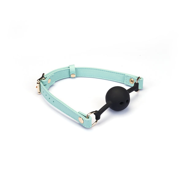 Italian Leather Breathable Ball Gag in light green with adjustable straps and black silicone ball, suitable for dopamine fashion accessory