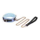 Light blue Italian leather collar with velvet lining and adjustable buckle, paired with gold chain leash and black leather handle for a fashionable bondage accessory