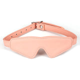 Pink vegan leather bondage blindfold from the Dark Candy collection with adjustable strap and golden buckle