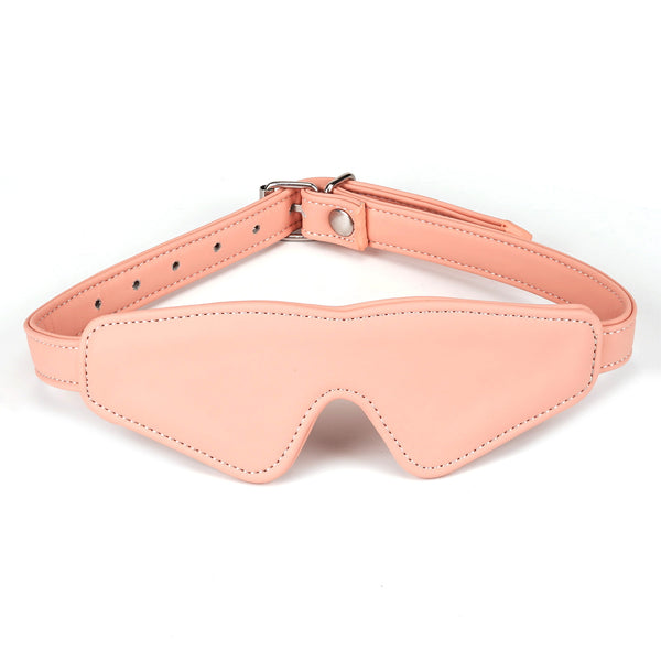Pink vegan leather bondage blindfold from the Dark Candy collection with adjustable strap and golden buckle