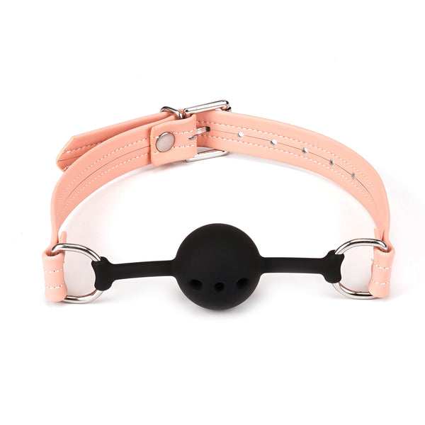 Pink breathable silicone ball gag with vegan leather straps and silver hardware from the Dark Candy collection