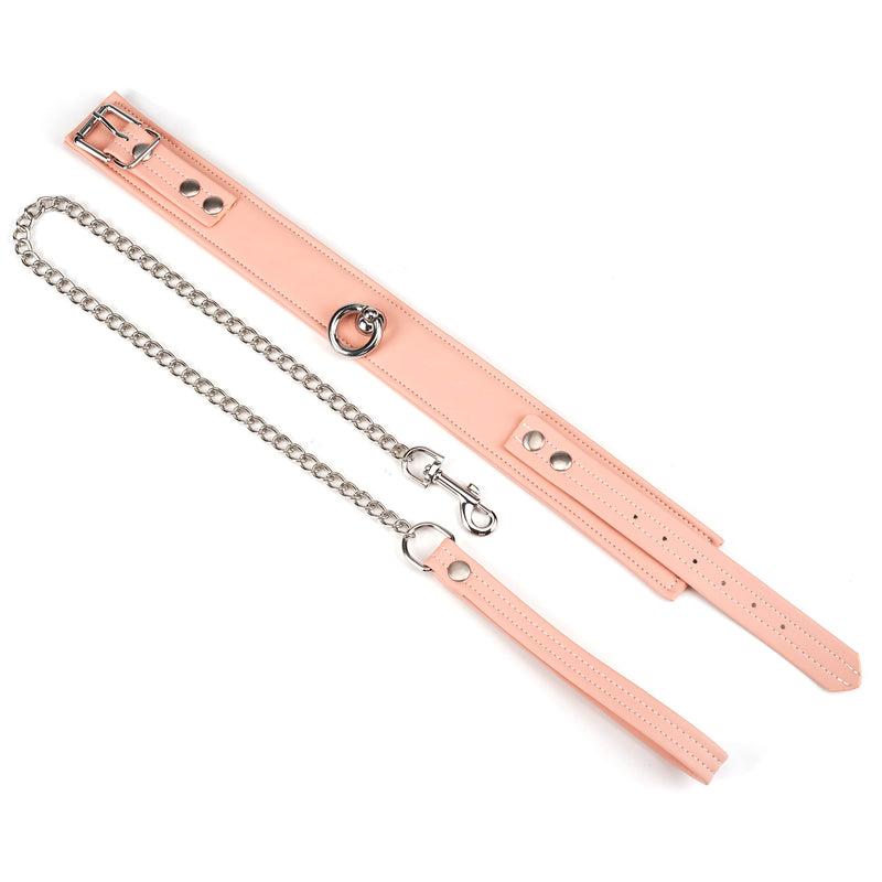 Pink vegan leather bondage collar with silver chain leash from the Dark Candy collection, highlighting adjustable features and D-ring for BDSM accessories
