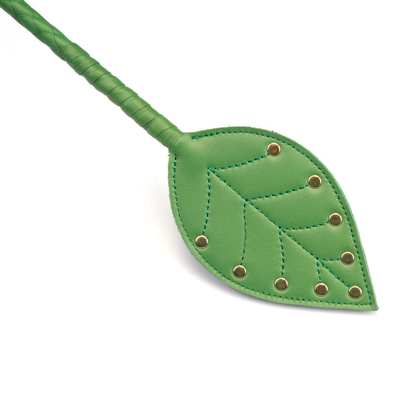 Premium cow leather leaf-shaped paddle with braided handle and decorative studs from LIEBE SEELE.