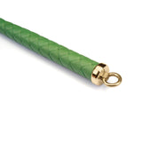 Green leather handle of customized leather leaf crop with gold-colored metal ring detailing