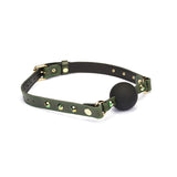 Luxury green leather ball gag with gemstone accents for erotic bondage play