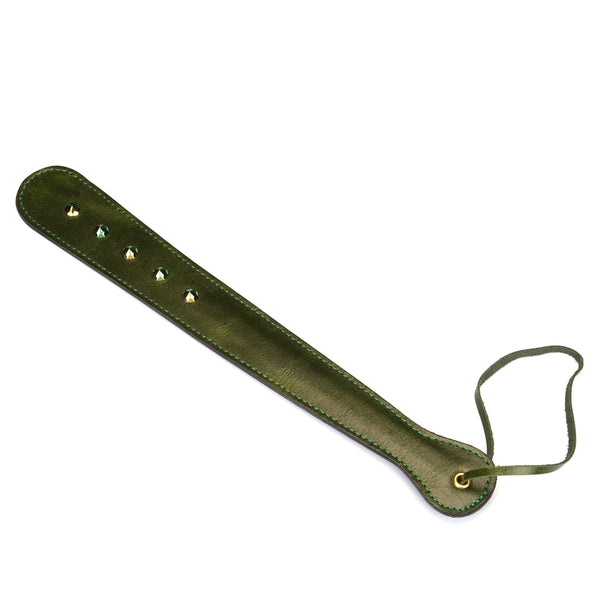 Luxury green leather gemstone paddle for erotic play, featuring embedded gemstones and wrist strap