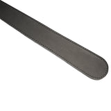 Close-up of luxury grey leather paddle with detailed stitching, for erotic bondage play