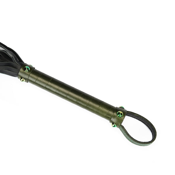 Luxury green leather flogger with gemstone accents demonstrating quality craftsmanship and unique design for BDSM play