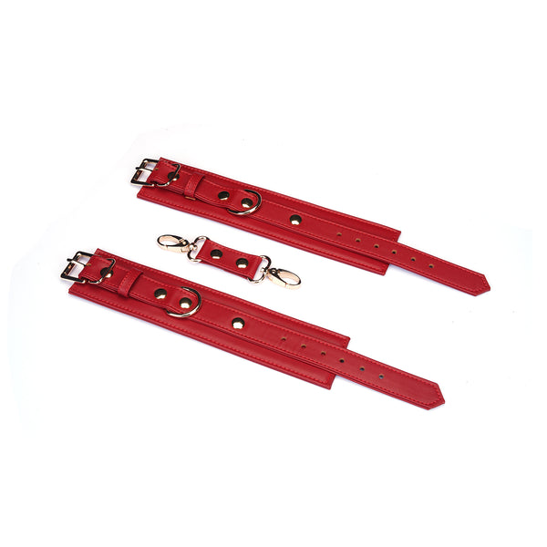 Adjustable red faux leather wrist cuffs with metal buckles and D-rings, product number HC-80870RD
