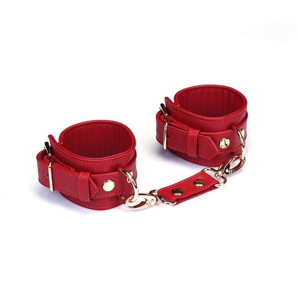 Red faux leather wrist cuffs with adjustable straps and metallic detailing for bondage play, model HC-80870RD