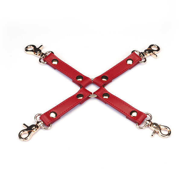 Red faux leather hogtie with gold-tone metal clips for bondage play, item number HT-80867RD