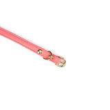 Close-up of rose red Italian leather choker with gold buckle and detailed stitching for bondage fashion