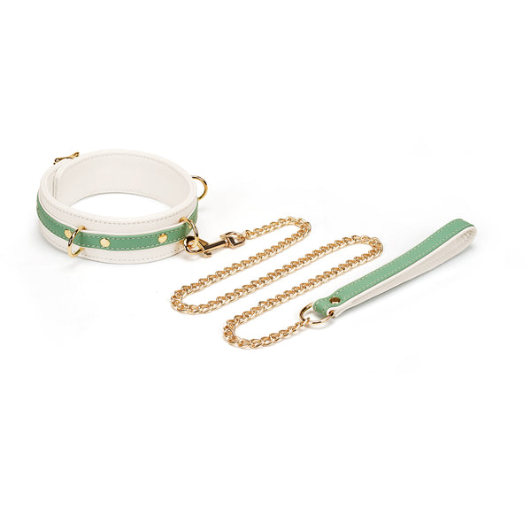 White and green leather bondage collar with gold chain leash from the Fairy collection, designed for stylish and versatile BDSM play