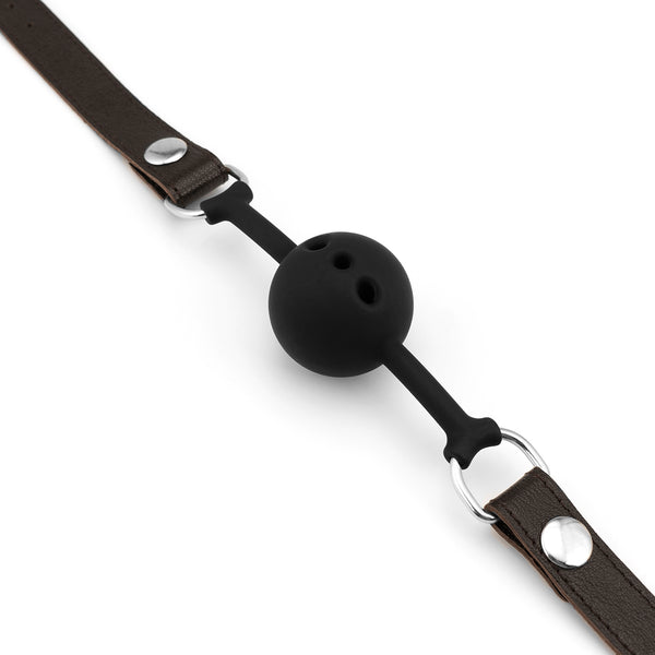 Luxurious Wild Gent breathable silicone ball gag with brown leather straps and silver metal buckles, designed for BDSM play