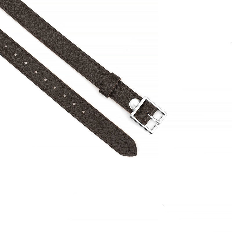 Dark brown lamb skin leather strap with silver buckle, part of Wild Gent breathable ball gag, designed for optimized comfort and adjustable fit in BDSM gear