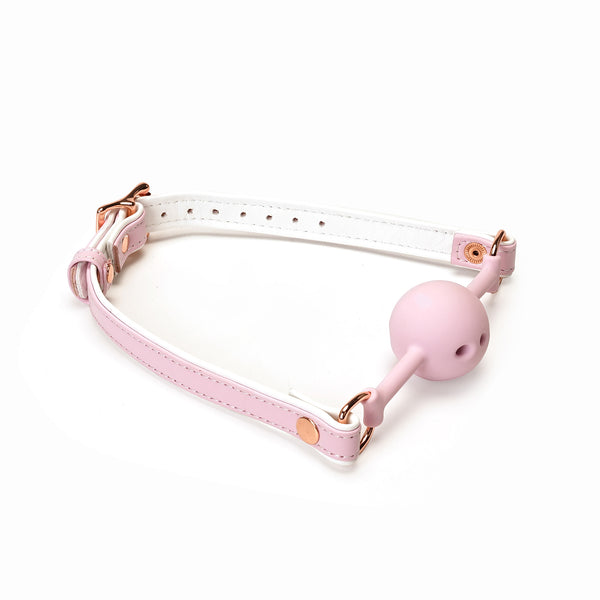 Pink and white leather ball gag with breathable silicone ball and rose gold hardware from the Fairy BDSM collection