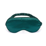 Silky green satin blindfold sleeping mask with elastic straps and soft lining for sensory deprivation and comfort